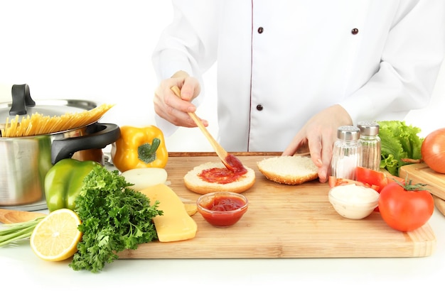 Chef preparing ingredients on wooden board
